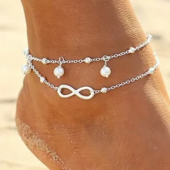 Tradera Fotlänkar<20 cm 25 cm Fotsmycke Fotlänk Ankellänk Fotkedja pärlor infinity silver färg