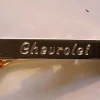 Tradera Slipsnålar<Chevrolet slipshållare i gulmetall