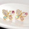 Tradera Örhängen<Unika Guld Stud Örhängen - Glittrande Fjärilar med Rhinestones i Olika Färger