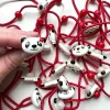 Tradera Varupartier<VARUPARTI 35 st - Hårsnoddar i röd färg med gullig panda från Lollipop